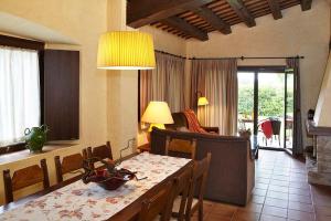 a dining room with a table and a room with a dining room at MAS CAN SALVI in Parlavà