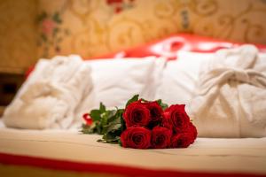 Un ou plusieurs lits dans un hébergement de l'établissement Hotel Santo Stefano