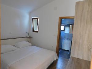 Postel nebo postele na pokoji v ubytování Apartments Žile