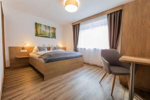 Posteľ alebo postele v izbe v ubytovaní Berg' & Bluamen Appartements Stubai
