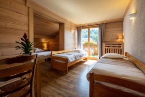 Postel nebo postele na pokoji v ubytování Hôtel La Montagne