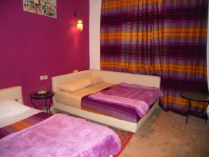 Postel nebo postele na pokoji v ubytování Riad Passiflora