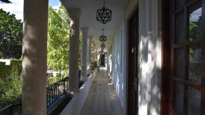 a hallway of a white house with a window at Hotel Zamna Boutique in Mérida +52 photos