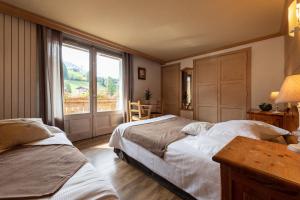 Postel nebo postele na pokoji v ubytování Hôtel La Montagne