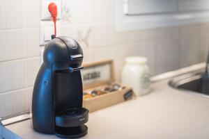 a hair dryer sitting on a counter next to a sink at Photostory Art Studio in Athens