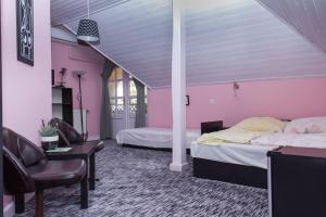 Posteľ alebo postele v izbe v ubytovaní Familia Apartman 304