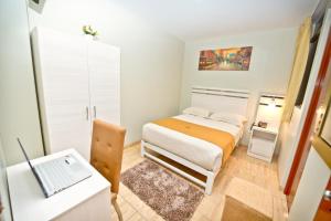 Postel nebo postele na pokoji v ubytování Mercé Hotel