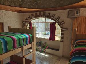 Postel nebo postele na pokoji v ubytování El Sunset Hostel