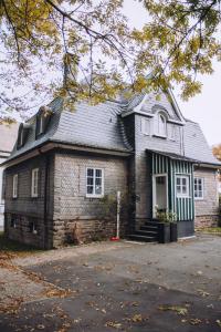 a large brick house with a gambrel roof at Landfein-Villa Marathon in Winterberg