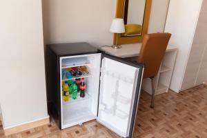Kuchyň nebo kuchyňský kout v ubytování Mercé Hotel