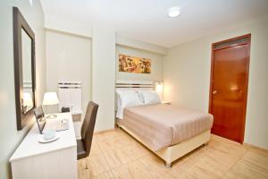 Postel nebo postele na pokoji v ubytování Mercé Hotel