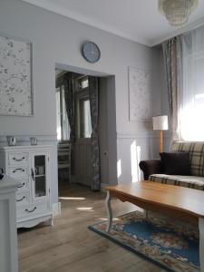 a living room with a couch and a table at My Home in Stara Zagora