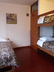Cama o camas de una habitación en Suzet House