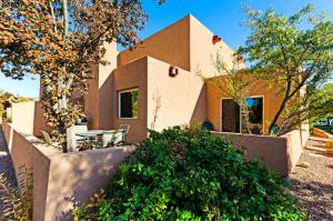a home in the desert with trees and bushes at Solano Vallejo 3283 in Moab
