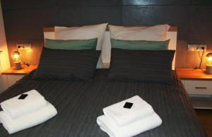 Posteľ alebo postele v izbe v ubytovaní Aqua Apartments Sunset