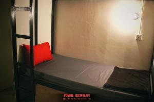 Katil atau katil-katil dalam bilik di Pomme Brewhouse Hostel