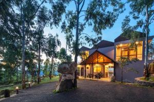 a house with a rock in front of it at Dream Cliff Mountain Resort in Haputale +37 photos