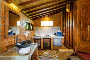 a bathroom with a sink and a bath tub at Bali Natha Beach Front in Canggu