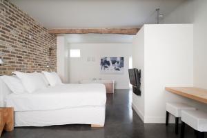 Postel nebo postele na pokoji v ubytování Cour 8 Lofts