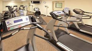 a gym with treadmills and elliptical machines at Holiday Inn Express Little Rock-Airport, an IHG Hotel in Little Rock