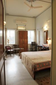 a bedroom with a bed and a table and chairs at Tara Niwas in Jaipur