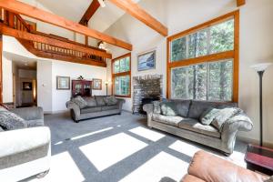 a living room with couches and a fireplace at Alderhill in Shaver Lake