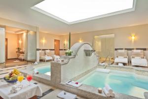 a large pool in a hotel room with a spa at Hotel Marquis Reforma in Mexico City