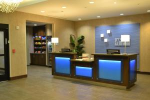 a lobby of a hotel with blue lights in it at Holiday Inn Express & Suites Midland South I-20, an IHG Hotel in Midland