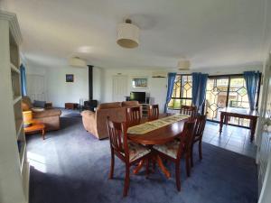 a living room with a table and chairs and a couch at Chateau Bass in Bass