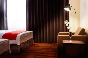 Postel nebo postele na pokoji v ubytování Hoya Resort Hotel Kaohsiung
