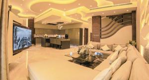 a large living room with a couch and a table at Exquisite Palm Villa with Private Beach, Palma Residences in Dubai