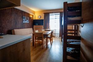 a kitchen and dining room with a table and chairs at Apartment in Gudauri in Gudauri