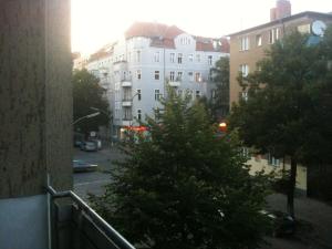 a view from a balcony of a building with a christmas tree at Kant in Berlin