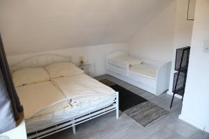Ένα ή περισσότερα κρεβάτια σε δωμάτιο στο Ferienwohnung Stöckel 2