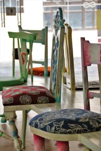 a group of chairs sitting in a room at Authentic Tavira Hotel in Tavira