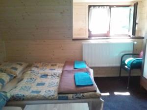 Postel nebo postele na pokoji v ubytování Chata Ivan