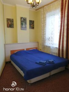 Posteľ alebo postele v izbe v ubytovaní Hotel Lotos