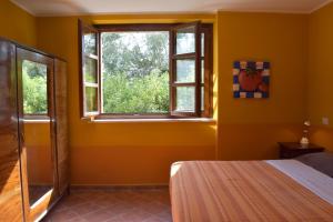 Postel nebo postele na pokoji v ubytování Casa Ciao Bella - Apartment Sunshine with shared pool