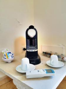 a black blender sitting on top of a counter at Terre Di Vendicari in Noto