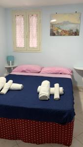 Letto o letti in una camera di DEA PARTHENOPE