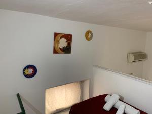 Letto o letti in una camera di DEA PARTHENOPE