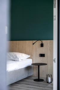 A bed or beds in a room at Sambucus Apartments -Premium Apartments for You and Your Dog
