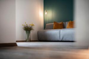 A bed or beds in a room at Sambucus Apartments -Premium Apartments for You and Your Dog