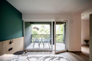 A bed or beds in a room at Sambucus Apartments -Premium Apartments for You and Your Dog