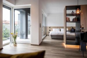 A bed or beds in a room at Sambucus Apartments -Premium Apartments for You and Your Dog