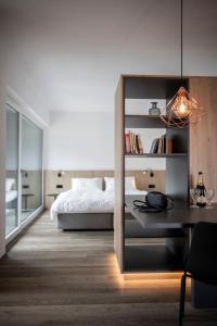 A bed or beds in a room at Sambucus Apartments -Premium Apartments for You and Your Dog
