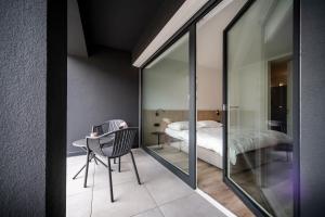 A bed or beds in a room at Sambucus Apartments -Premium Apartments for You and Your Dog