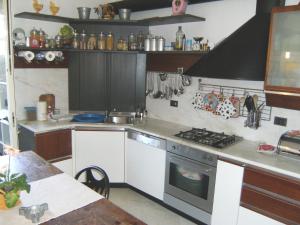 a kitchen with a stove and a counter top at La Casina in Marina di Massa