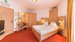Ένα ή περισσότερα κρεβάτια σε δωμάτιο στο Hotel Millanderhof