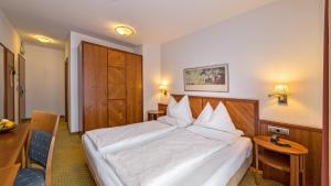 Ένα ή περισσότερα κρεβάτια σε δωμάτιο στο Hotel Millanderhof